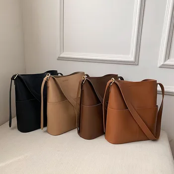 Yeni kova çanta, yüksek kaliteli ve büyük kapasiteli tasarım omuz çantası ve çapraz askılı kadınlar için modaya uygun ve çok yönlüdür